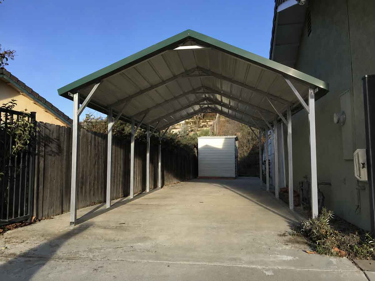Completed horizontal A-frame carport covering the same driveway
