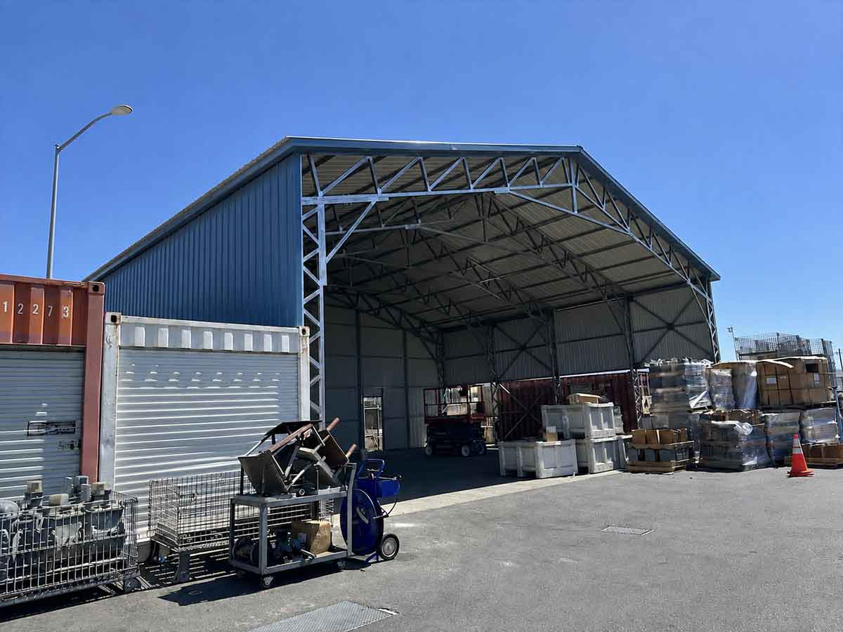 Completed wide-span metal building covering the same property area